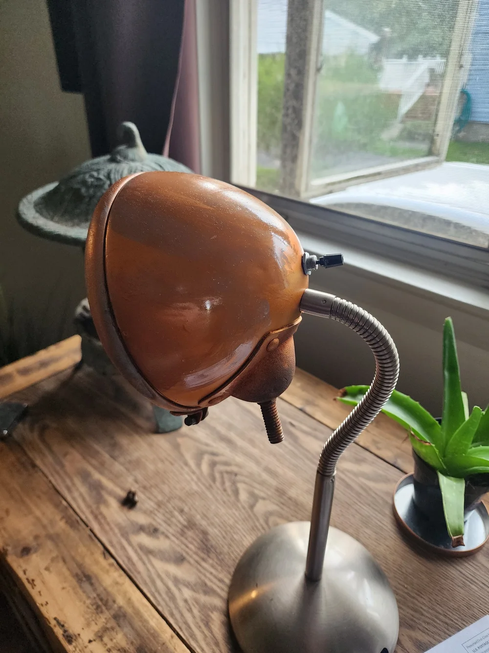 Antique car bucket light repurposed into a table lamp.